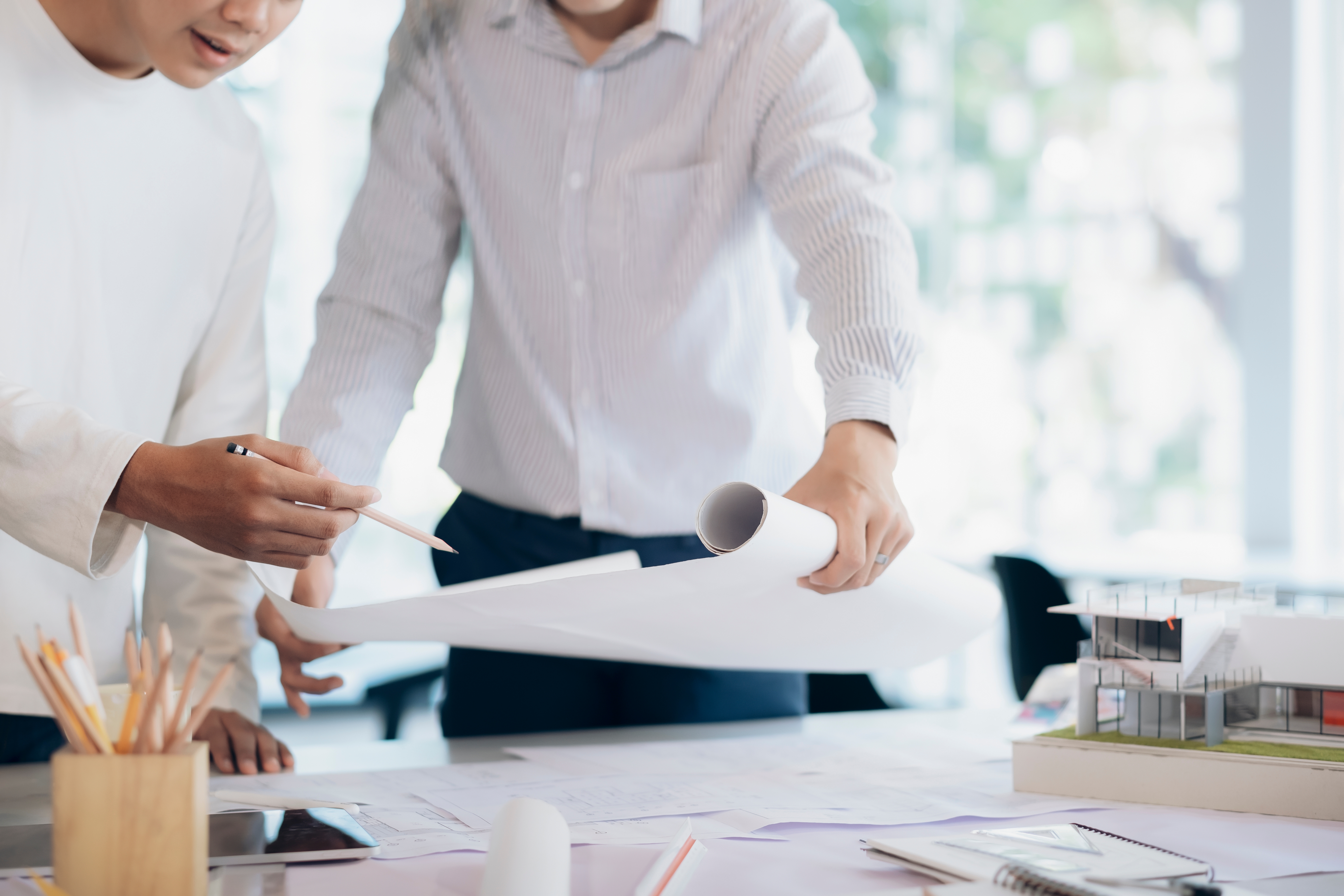 Design team discussing cultural project blueprint